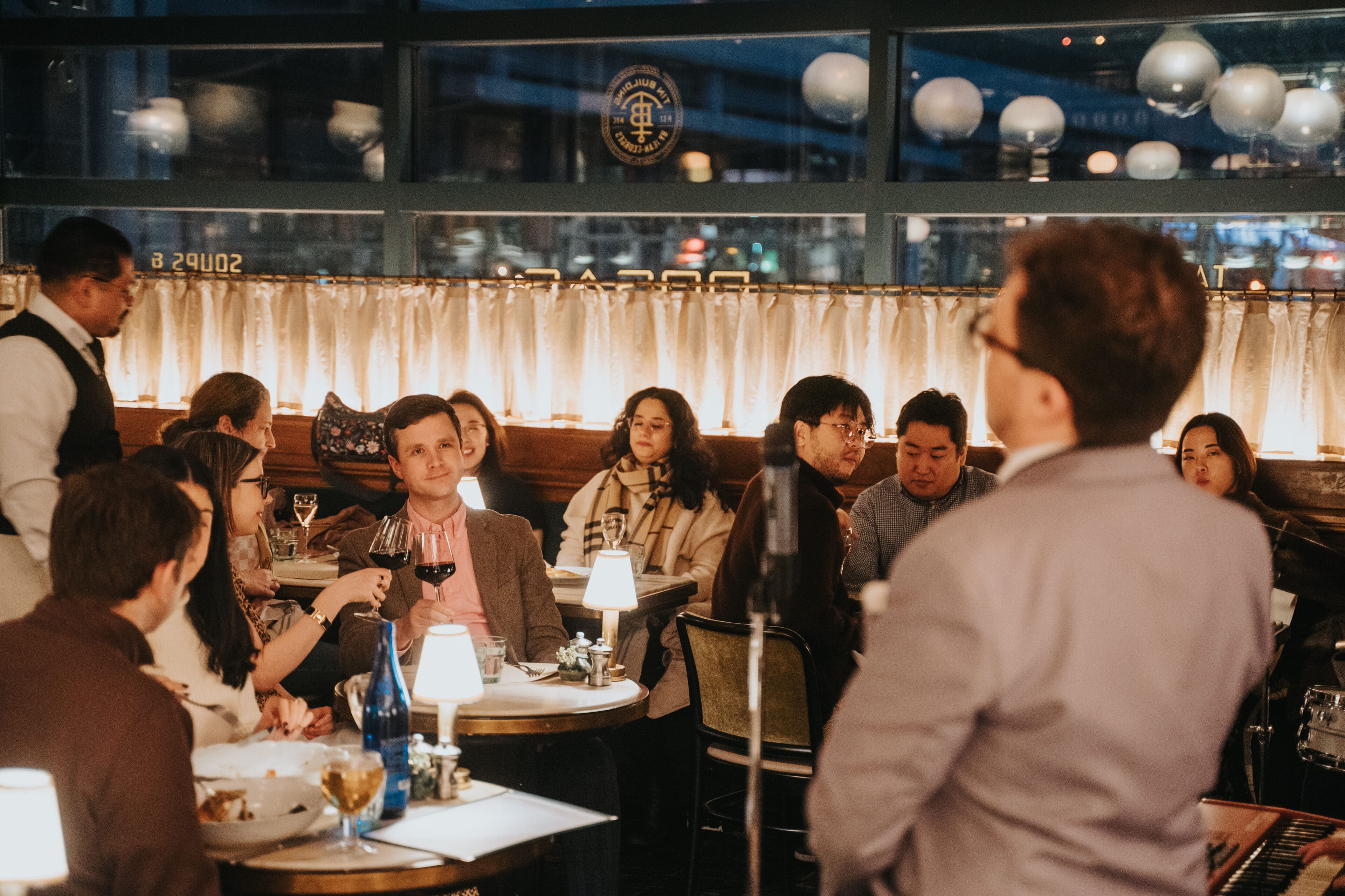 a group of people enjoy a dinner at t.brasserie 